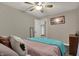 Bedroom with neutral walls featuring a ceiling fan and comfortable decor at 8734 Blue Marlin Dr, Indianapolis, IN 46239