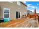 Wood deck off the home's rear with room for outdoor dining and entertaining, accessible through a sliding glass door at 8734 Blue Marlin Dr, Indianapolis, IN 46239