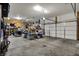 Spacious garage with room for parking and storage, featuring a functional garage door and ample shelving at 8734 Blue Marlin Dr, Indianapolis, IN 46239