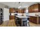 Spacious kitchen featuring an island with barstool seating and wood cabinets, perfect for gatherings at 8734 Blue Marlin Dr, Indianapolis, IN 46239