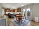 Bright and airy kitchen flows seamlessly into a dining area with a stylish rug and patio access at 8734 Blue Marlin Dr, Indianapolis, IN 46239