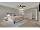 Comfortable main bedroom with a ceiling fan, natural light, and neutral tones at 8734 Blue Marlin Dr, Indianapolis, IN 46239