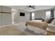 Main bedroom with carpet, a ceiling fan and a large closet at 8734 Blue Marlin Dr, Indianapolis, IN 46239