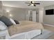 Bedroom featuring a ceiling fan, a large bed, and multiple windows for ample natural light at 8734 Blue Marlin Dr, Indianapolis, IN 46239