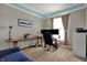 Bright and functional home office featuring hardwood floors, neutral walls, and ample workspace at 8734 Blue Marlin Dr, Indianapolis, IN 46239