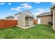 Well-kept shed in a fenced backyard, providing additional storage space for tools and equipment at 8734 Blue Marlin Dr, Indianapolis, IN 46239