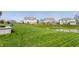 Beautiful backyard with a tranquil pond and a neatly manicured lawn at 8855 Sugar Cay Ct, Zionsville, IN 46077