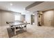 Finished basement area with a ping pong table for recreation and leisure at 8855 Sugar Cay Ct, Zionsville, IN 46077