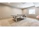 Recreational basement with a ping pong table and carpet flooring at 8855 Sugar Cay Ct, Zionsville, IN 46077