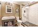 Modern bathroom featuring a glass-enclosed shower and stylish vanity with open storage at 8855 Sugar Cay Ct, Zionsville, IN 46077