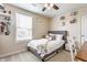 Cozy bedroom with neutral walls, a plush bed, and natural light from the window at 8855 Sugar Cay Ct, Zionsville, IN 46077