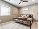 Charming bedroom featuring a wood and iron bed frame, soft carpet, and a ceiling fan at 8855 Sugar Cay Ct, Zionsville, IN 46077