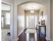 Bright foyer with hardwood floors, arched entryway, and stylish light fixture, creating a grand entrance at 8855 Sugar Cay Ct, Zionsville, IN 46077