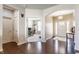 Spacious foyer featuring hardwood floors and an open view of an adjacent office space, offering versatility at 8855 Sugar Cay Ct, Zionsville, IN 46077