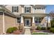 Welcoming front entrance with brick accents, decorative columns, and a cozy porch, enhancing curb appeal at 8855 Sugar Cay Ct, Zionsville, IN 46077