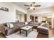 Inviting living room featuring hardwood floors, large sectional and open layout at 8855 Sugar Cay Ct, Zionsville, IN 46077