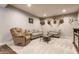 Cozy living room with plush seating, soft carpet, and a unique deer head decor at 8855 Sugar Cay Ct, Zionsville, IN 46077