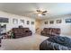 Large living area features plush seating, overhead fan and ample natural light at 8855 Sugar Cay Ct, Zionsville, IN 46077