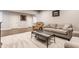Inviting living room with stylish seating, soft carpet and a glass-topped coffee table at 8855 Sugar Cay Ct, Zionsville, IN 46077
