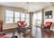 Cozy sun room with hardwood floors, comfortable furniture and bright natural light at 8855 Sugar Cay Ct, Zionsville, IN 46077