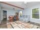 Bonus room featuring a sofa, dining table with chairs and a wooden bookcase for storage at 1000 Janet Dr, Greenwood, IN 46142