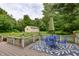 Cozy deck area with a blue outdoor seating set, perfect for enjoying the view of the backyard at 1000 Janet Dr, Greenwood, IN 46142