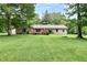 Charming one-story home with brick accents, a spacious yard, and mature trees at 1000 Janet Dr, Greenwood, IN 46142