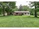Charming one-story home with brick accents, a spacious yard, and mature trees at 1000 Janet Dr, Greenwood, IN 46142