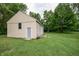 Exterior view of a detached garage with a door and ample space, ideal for storage and projects at 1000 Janet Dr, Greenwood, IN 46142