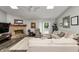Bright living room with fireplace, skylights, and comfortable furnishings at 1000 Janet Dr, Greenwood, IN 46142