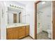 Bathroom featuring a vanity with a sink and a mirror, as well as a shower and toilet at 1012 S Montgomery Rd, Greenwood, IN 46143