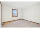 A bright bedroom featuring neutral paint, trim, and carpet with a window at 1012 S Montgomery Rd, Greenwood, IN 46143