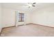 Bedroom features neutral carpet, trim, a window, and a ceiling fan at 1012 S Montgomery Rd, Greenwood, IN 46143