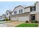 Charming townhome showcasing attached garages, green grass and well-maintained landscaping at 1012 S Montgomery Rd, Greenwood, IN 46143
