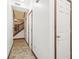 Welcoming foyer features neutral walls, tile flooring, and multiple doorways and leads to a wooden staircase at 1012 S Montgomery Rd, Greenwood, IN 46143