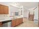 Kitchen boasts stainless appliances, light countertops, and a convenient breakfast bar at 1012 S Montgomery Rd, Greenwood, IN 46143
