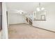 Bright living room with carpet, open to the staircase and other living area at 1012 S Montgomery Rd, Greenwood, IN 46143