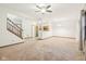 Inviting living area with neutral carpet open to the staircase and kitchen at 1012 S Montgomery Rd, Greenwood, IN 46143