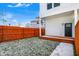 Backyard of a home with a wood deck, a privacy fence, and a small patch of grass at 1018 Calvary St, Indianapolis, IN 46203