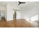 Spacious bedroom features wood floors and a sliding barn door to the bathroom at 1018 Calvary St, Indianapolis, IN 46203