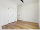 Bedroom featuring a ceiling fan, hardwood floors, and a closet at 1018 Calvary St, Indianapolis, IN 46203