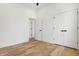 Bedroom with hardwood floors, closet, and doorway to another room at 1018 Calvary St, Indianapolis, IN 46203