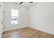 Bedroom with hardwood floors and a window providing natural light at 1018 Calvary St, Indianapolis, IN 46203