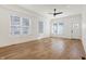 A bright and spacious living room with hardwood floors, large windows, and ample natural light at 1018 Calvary St, Indianapolis, IN 46203