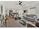 Open-concept living room with hardwood floors, modern decor, and a seamless flow into the dining area at 1018 Calvary St, Indianapolis, IN 46203