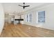Bright open living space with hardwood floors, large windows, and kitchen with a center island at 1018 Calvary St, Indianapolis, IN 46203