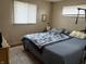 Bright bedroom with a comfortable bed, a window, and a rug at 1018 E 106Th St, Indianapolis, IN 46280