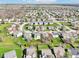 An aerial shot captures the neighborhood's layout and the property's location near community amenities at 10303 Memorial Knoll Dr, Indianapolis, IN 46234