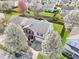 A high angle of a well-maintained home featuring beautiful trees and a backyard fence at 10303 Memorial Knoll Dr, Indianapolis, IN 46234