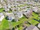 Beautiful aerial view of a neighborhood featuring lush lawns and mature trees in a suburban community at 10303 Memorial Knoll Dr, Indianapolis, IN 46234